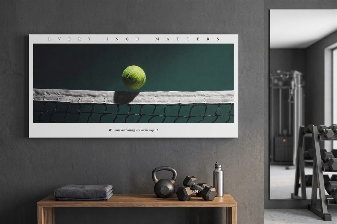 Garage gym ideas: Every Inch Matters tennis canvas on a concrete gym wall above a kettlebell and dumbbells
