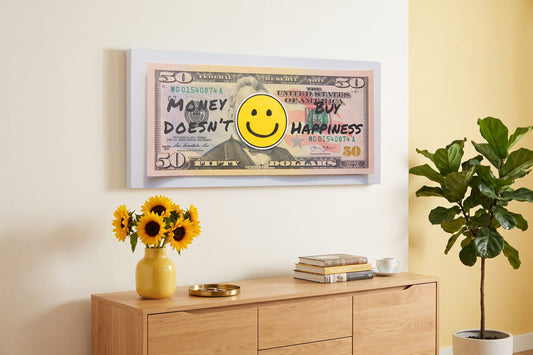 Happiness quotes: a Money Doesn't Buy Happiness canvas in a bright living room with sunflowers and a fiddle-leaf fig