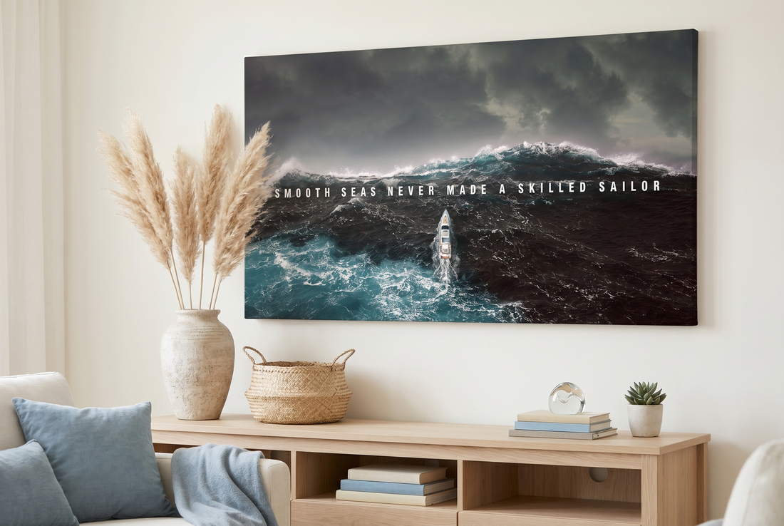 Ocean wall art: a Smooth Seas canvas above a console with pampas grass and a woven basket