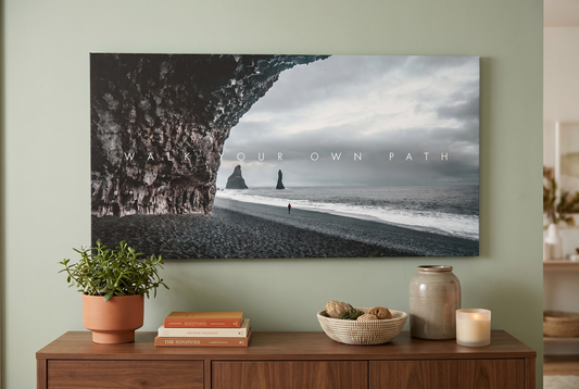 Nature wall art: a Walk Your Own Path canvas above a walnut console with a plant and books