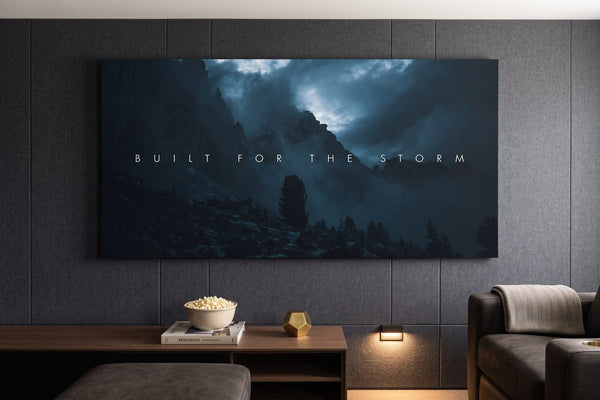 Home theater room ideas: a Built For The Storm canvas on an acoustic-paneled wall above tiered seating