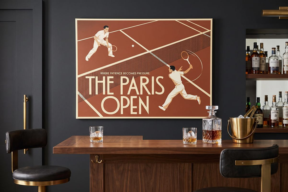 Man cave bar ideas: The Paris Open canvas above a home bar with a whisky decanter and ice bucket