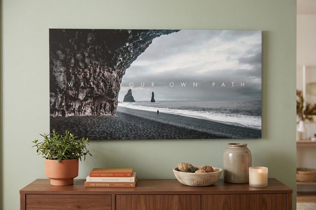 Nature wall art: a Walk Your Own Path canvas above a walnut console with a plant and books