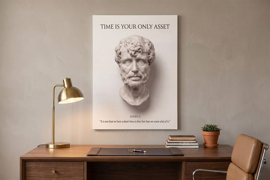 Office decor ideas for work: a Time Is Your Only Asset Seneca canvas above a desk with a brass lamp and books