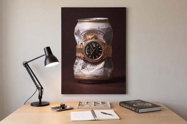 Parts of a watch: an Only Monday watch canvas above a watchmaker's oak worktable with a task lamp and a loupe tray