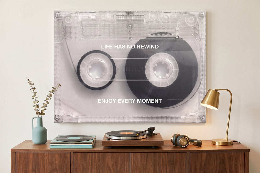 Retro wall art: a cassette tape canvas in a listening corner with a turntable, vinyl records and headphones