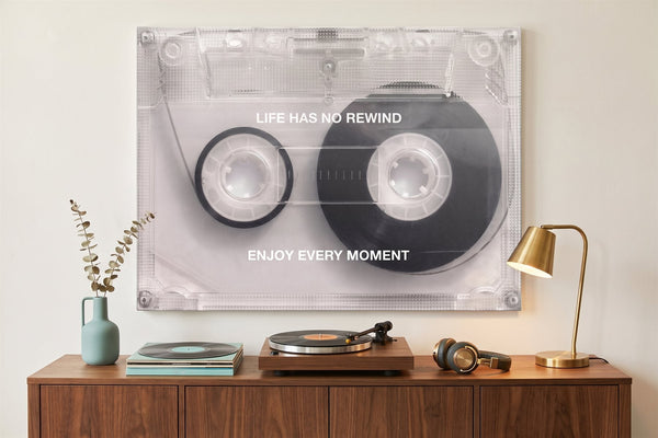 Retro wall art: a cassette tape canvas in a listening corner with a turntable, vinyl records and headphones