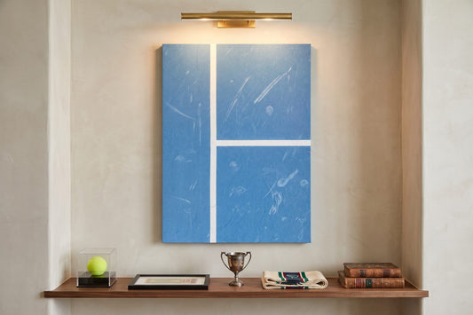 Sports memorabilia display ideas: an Aussie Court canvas above a walnut ledge with a ball case, trophy and framed stub