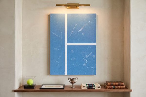 Sports memorabilia display ideas: an Aussie Court canvas above a walnut ledge with a ball case, trophy and framed stub