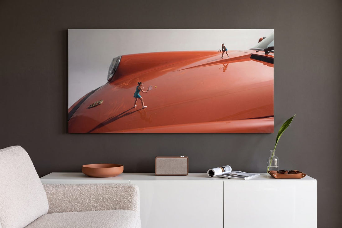 Tennis scoring explained: a Clay Hood wide tennis canvas in a charcoal lounge with a white console and a speaker