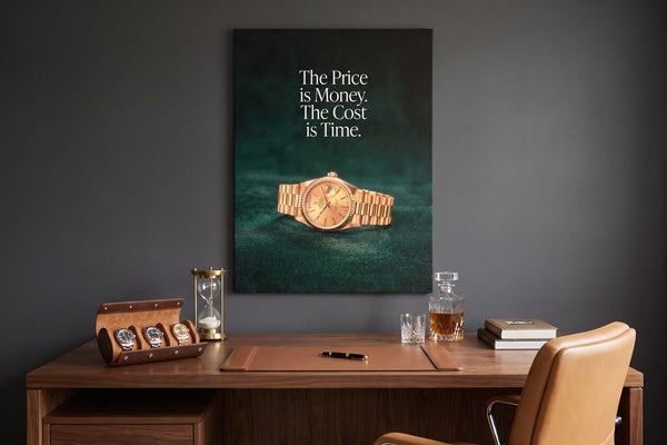 Time quotes: The Cost Is Time watch canvas in a charcoal study with a watch roll and a brass hourglass
