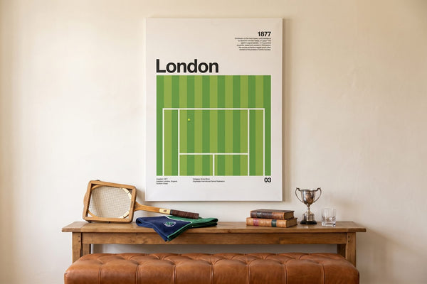 Vintage tennis racket decor: The London Slam canvas above a console with a wooden racket, silver trophy and brass lamp