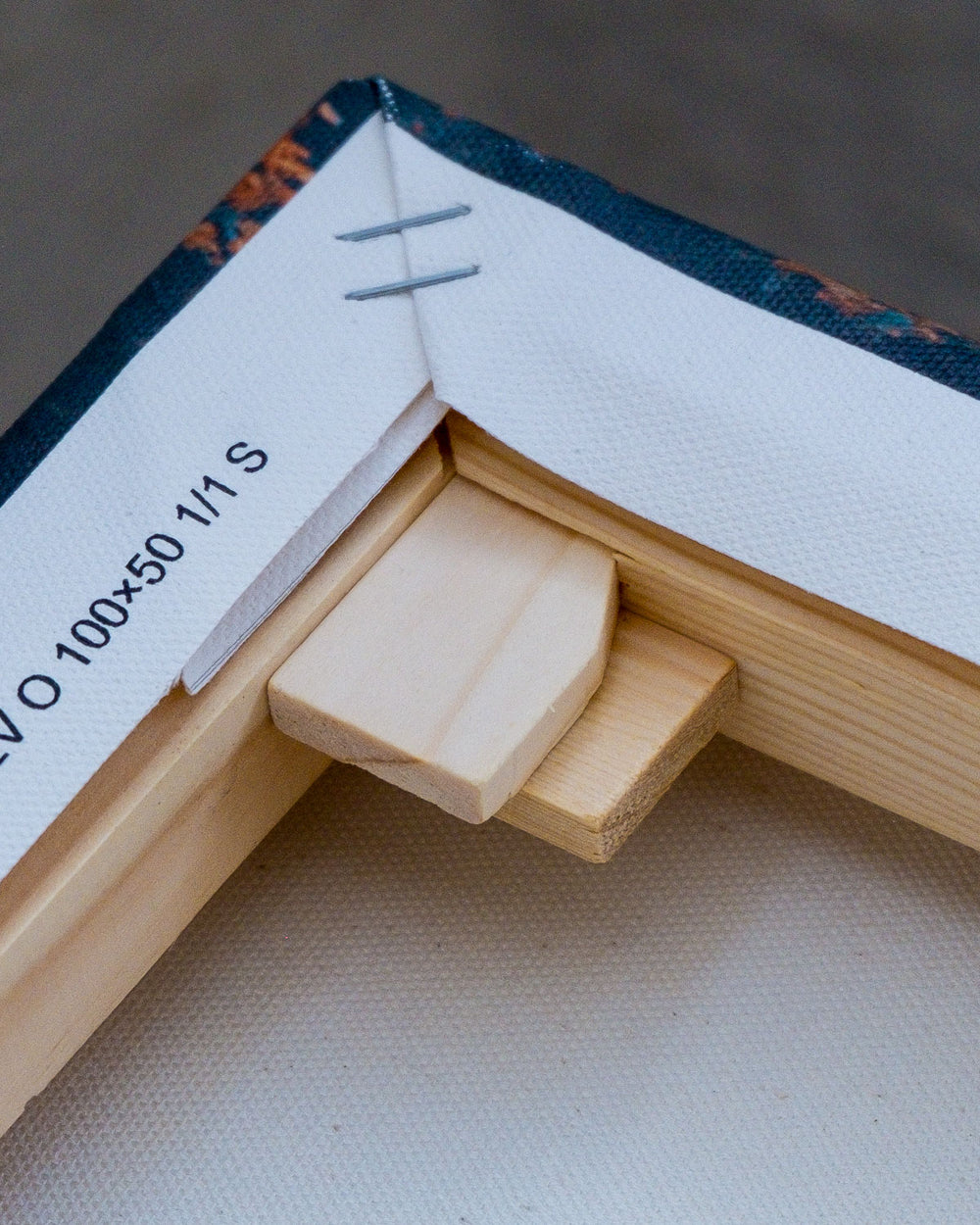 Close-up of a pine wood frame with finger-reinforced corner.