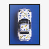 Amalfi Coast Roadster German roadster with a blue Sicilian maiolica and lemon pattern canvas wall art in a black floating frame