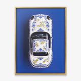 Amalfi Coast Roadster German roadster with a blue Sicilian maiolica and lemon pattern canvas wall art in a gold floating frame