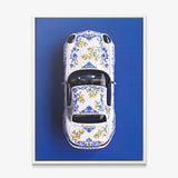 Amalfi Coast Roadster German roadster with a blue Sicilian maiolica and lemon pattern canvas wall art in a white floating frame