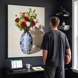 Man holding a football and looking up at the American Football Vase canvas in a charcoal home office