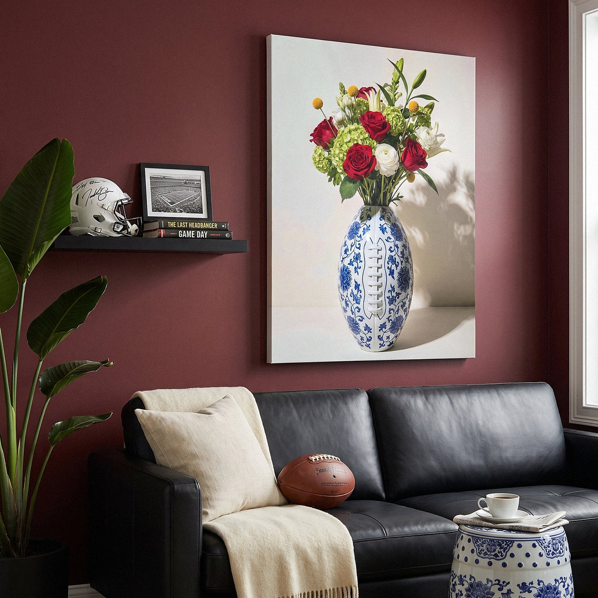 American Football Vase canvas above a black leather sofa in an oxblood living room