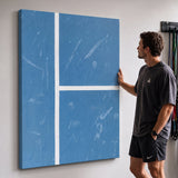 Person admiring the Aussie Court tennis canvas print in a styled interior