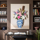 Baseball Vase canvas between shelves of graded baseball cards, a glove and baseball books in a mocha study