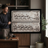Man holding the Boss Vs Leader marble canvas in a modern home office