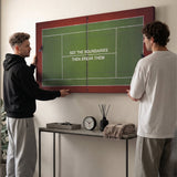 Two people viewing the Break Boundaries Match tennis canvas print together in a home setting