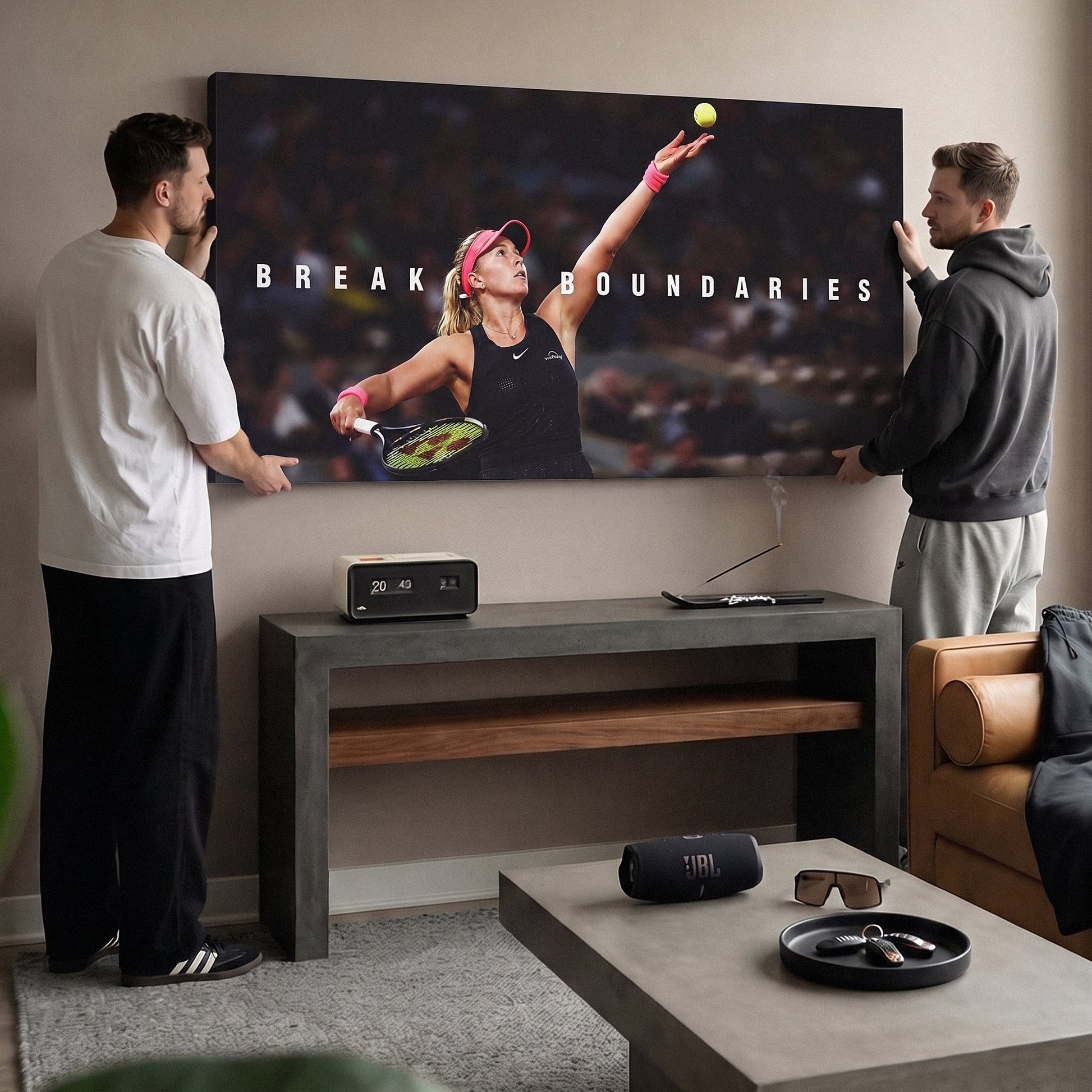 Two people viewing the Break Boundaries tennis canvas print together in a home setting