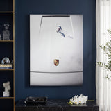 Car Boarding canvas hung on a navy wall above a black console with white orchids and a leather valet tray