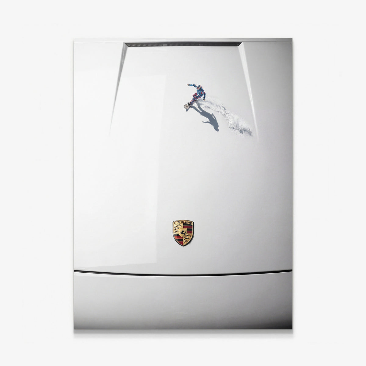 Car Boarding canvas wall art of a tiny snowboarder carving powder across a white sports car hood seen from above