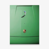 Car Putt canvas wall art of a golfer lining up a putt toward the hole on a green sports car hood seen from above