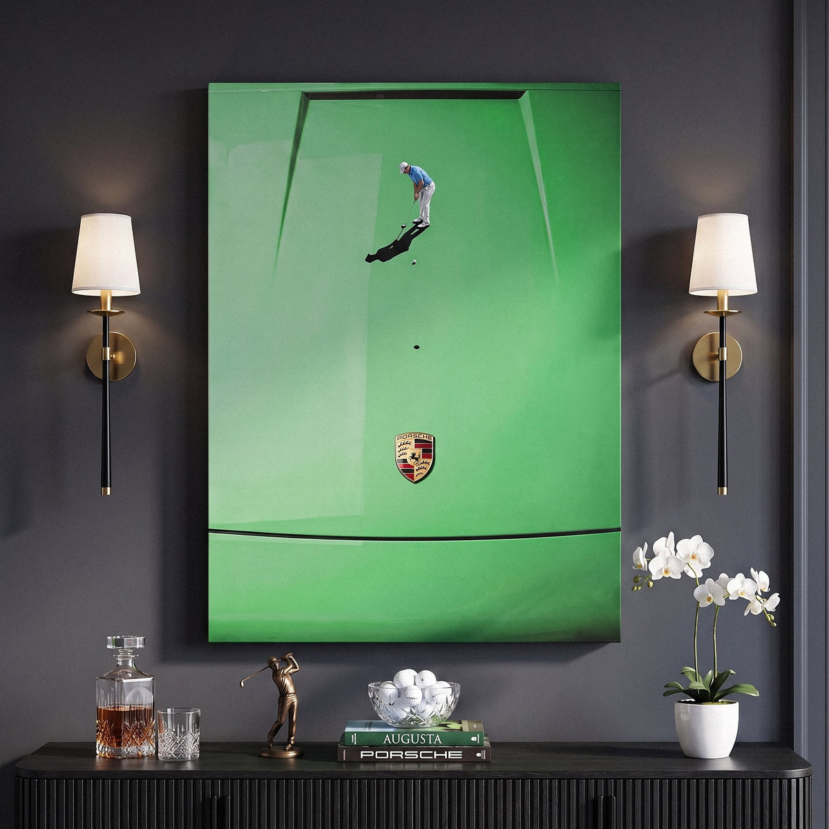 Car Putt canvas between two brass wall sconces on a charcoal wall above a fluted black sideboard with golf balls and whiskey