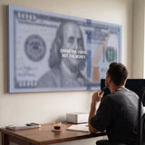 Man viewing the Chase The Vision Dollar Edition money canvas in a bright modern office
