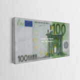A rectangular canvas wall art print showing a stylized 100 Euro banknote design, mounted against a plain light gray wall. White text on the artwork reads CHASE THE VISION.