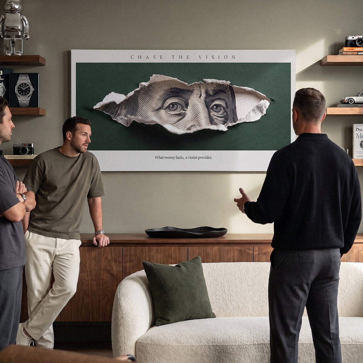 Chase The Vision Franklin wall art in a lounge with three men talking