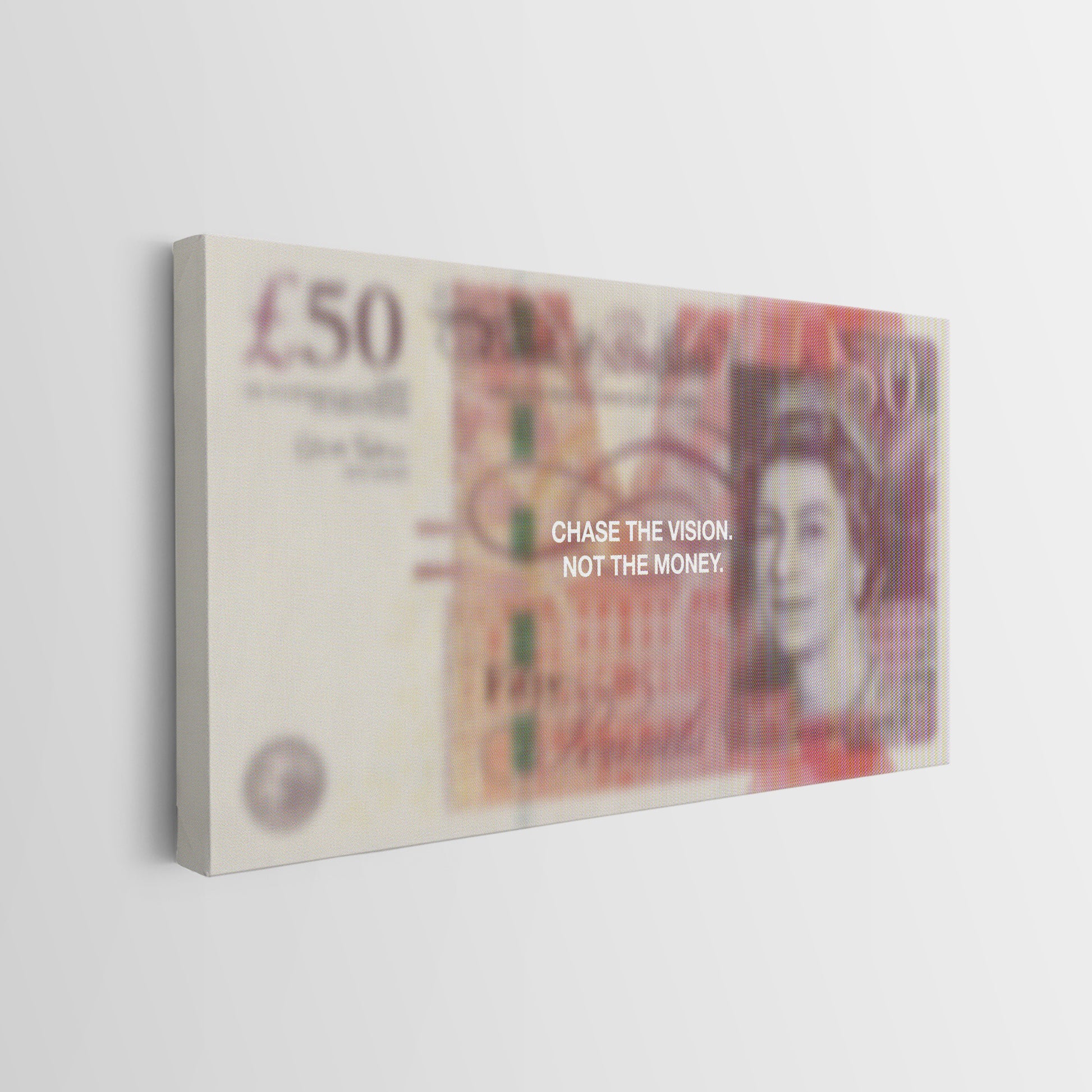 A rectangular canvas wall art print featuring a stylized, blurred depiction of a British £50 banknote with the text 'CHASE THE VISION, NOT THE MONEY.' printed across the center, shown hanging on a light gray wall.