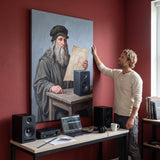 Da Vinci Amplified canvas above a desk with a person looking at it