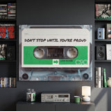 Don't Stop Until You Are Proud cassette canvas between tape library shelves above a cassette deck on a charcoal wall