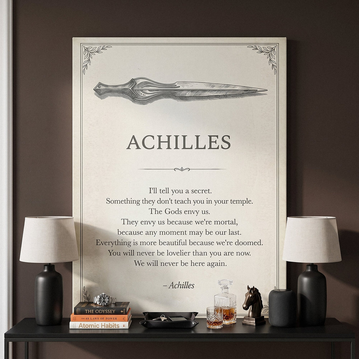 Doomed Achilles quote canvas above a black console in an espresso-brown living room
