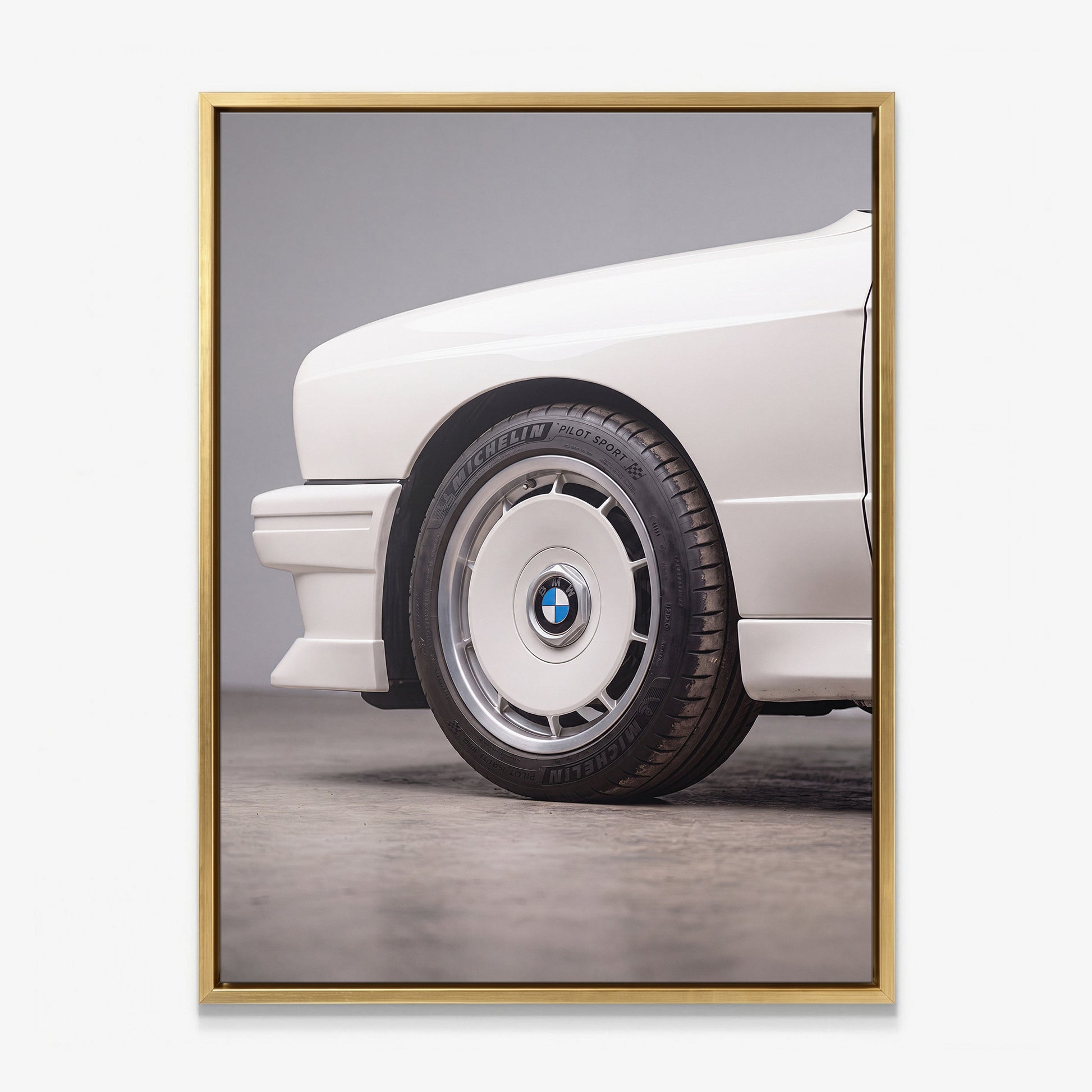E30 Wheel classic E30 coupe alloy wheel close-up canvas wall art in a gold floating frame
