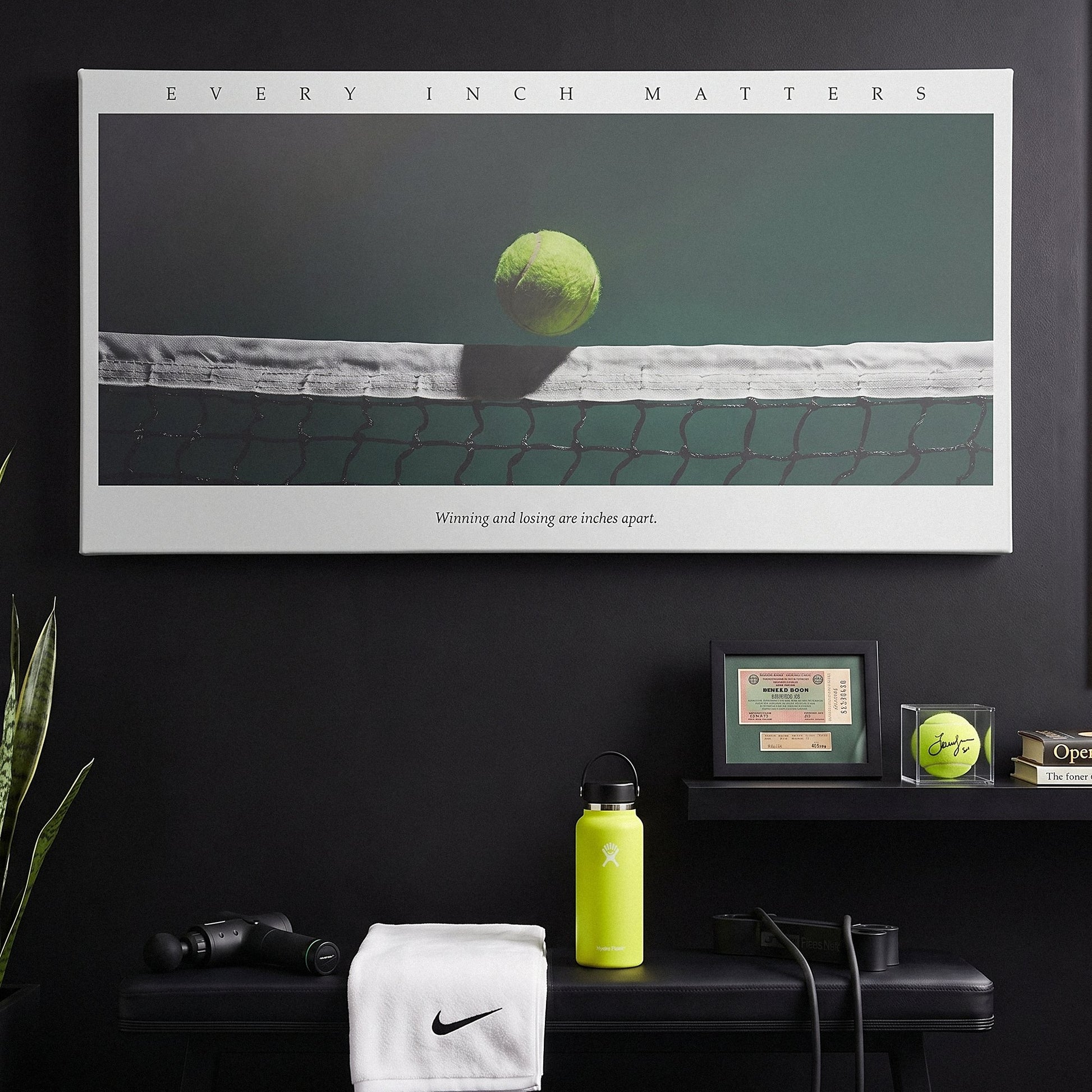 Every Inch Matters tennis wall art canvas above a console table in a bright modern hallway