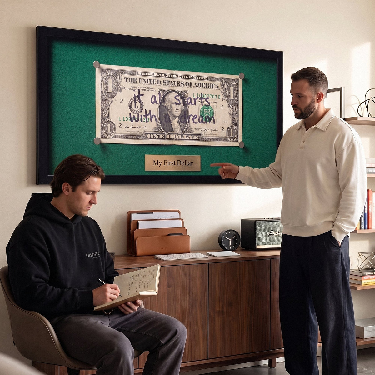 First Dollar wall art in a study with two men working