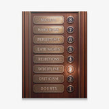 Floors To Success canvas wall art, a brass and walnut elevator panel listing Doubts, Criticism, Discipline and Success