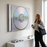 Person working at a desk below the Focus On Your Goals iridescent CD canvas