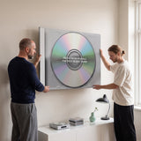 Couple relaxing in a lounge under the Focus On Your Goals iridescent CD canvas