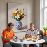 Two friends in rival football shirts trading stickers under the Football Vase canvas