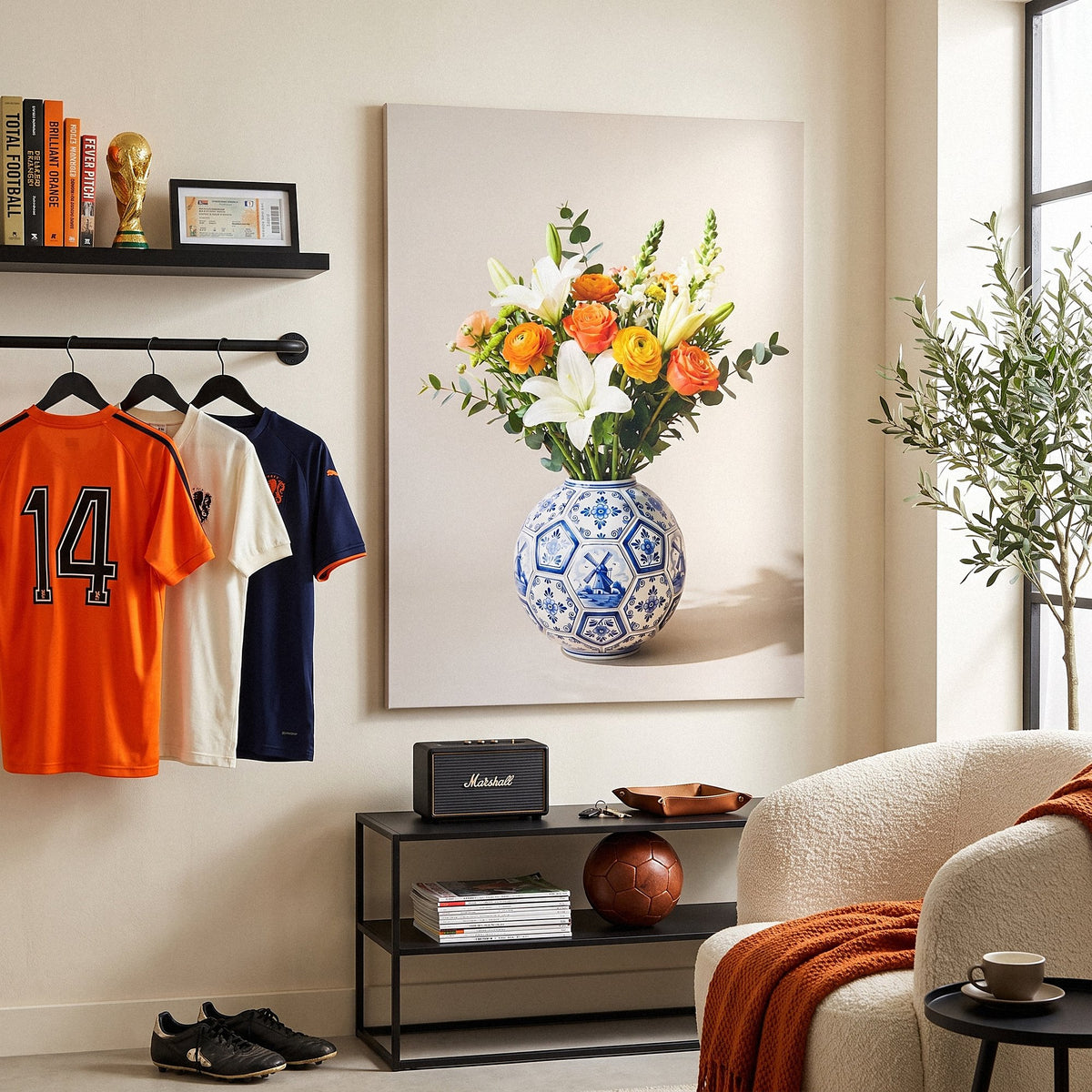Football Vase canvas next to football shirts on a rail in a cream living room