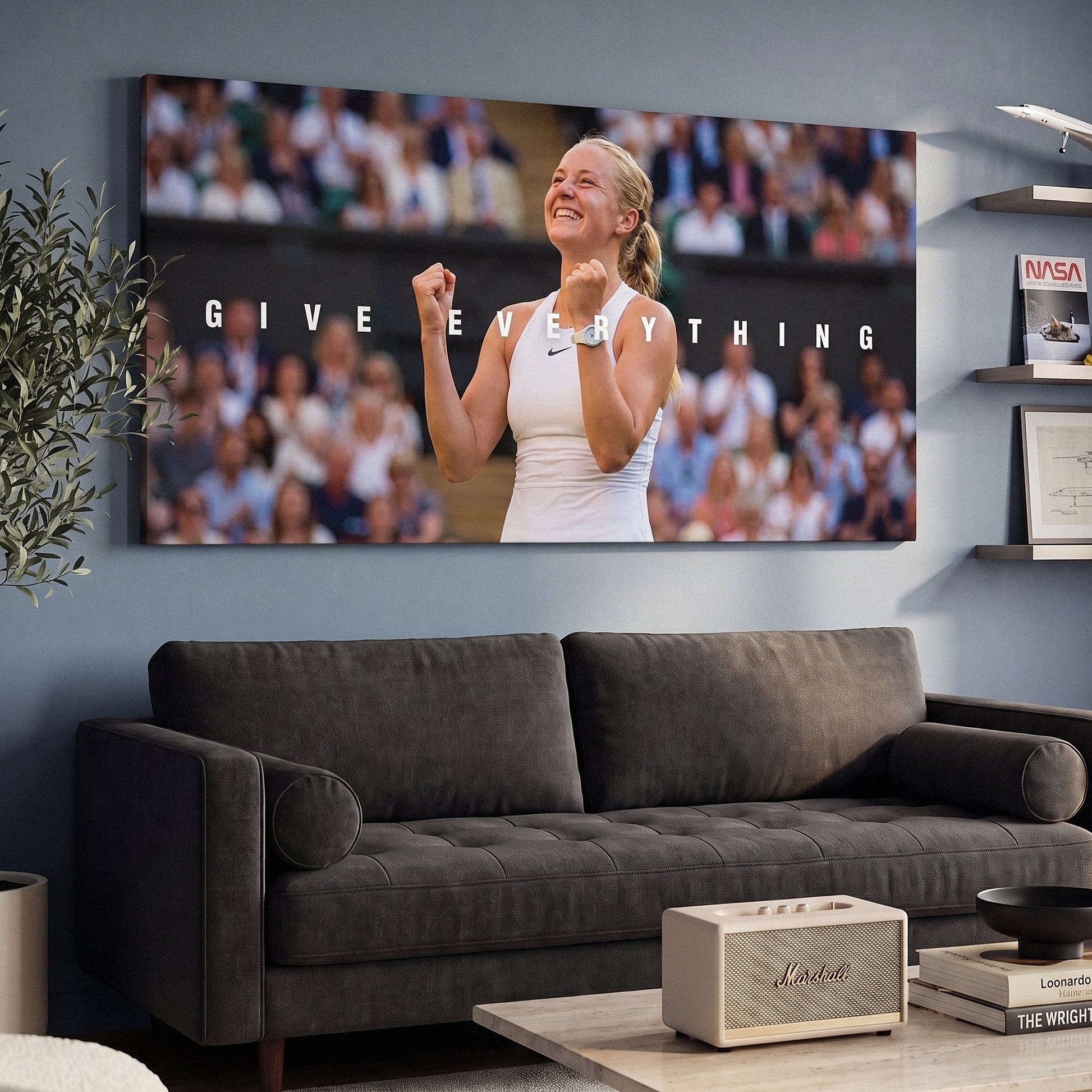 Give Everything tennis canvas print on a living room wall at a gentle angle showing the gallery-wrapped edge
