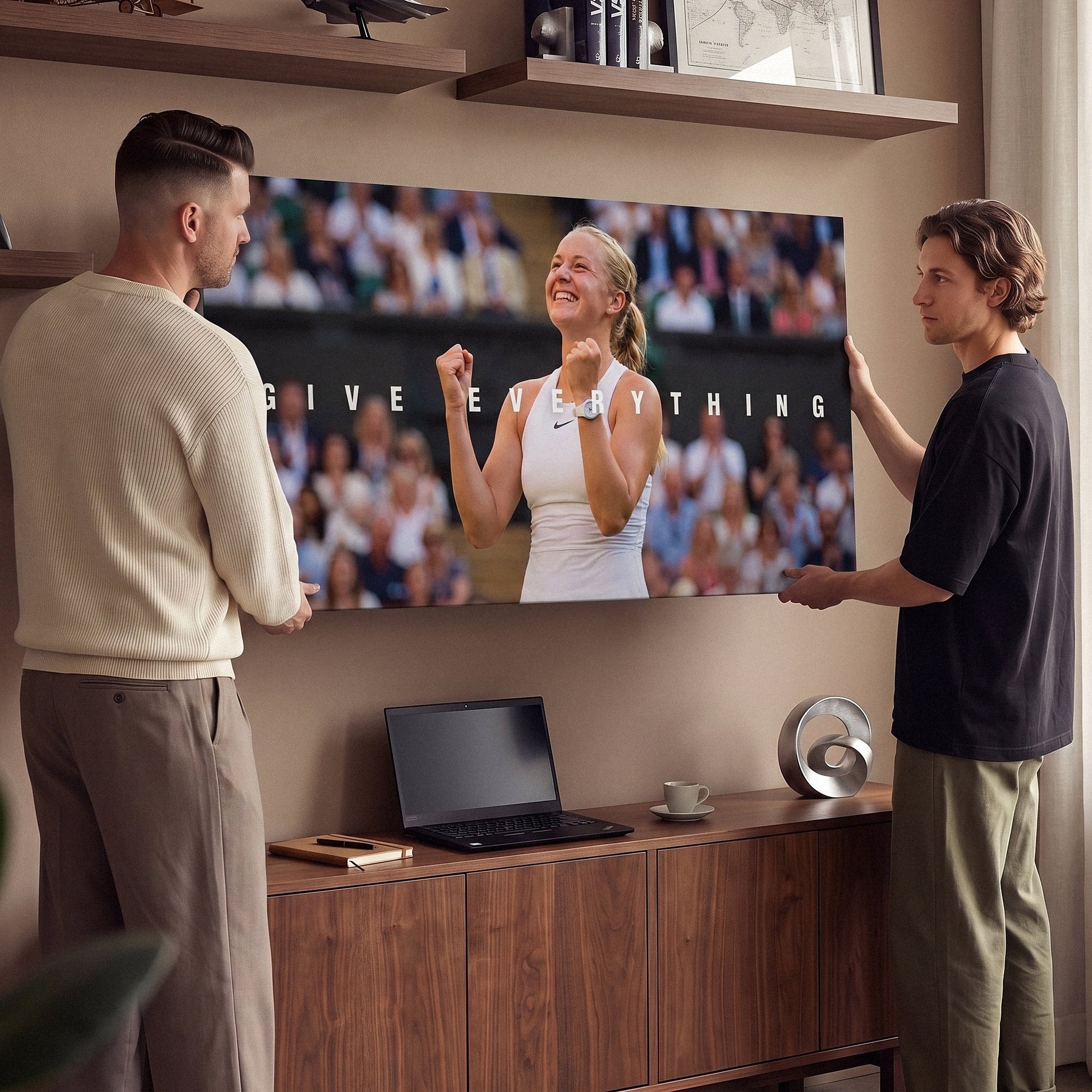 Two people viewing the Give Everything tennis canvas print together in a home setting