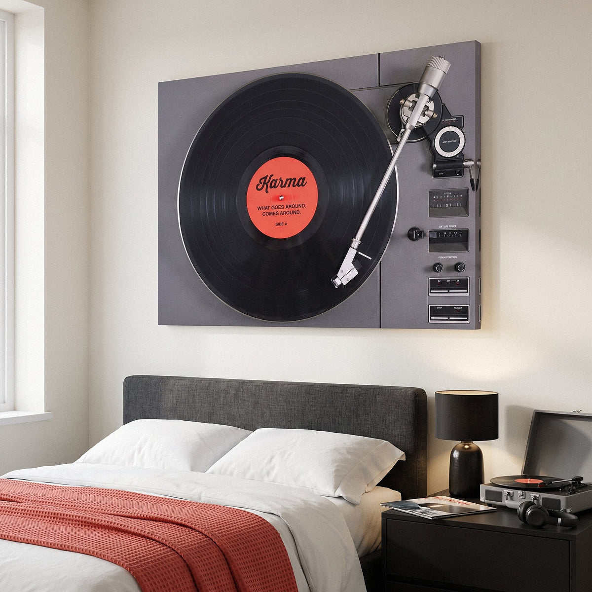 Karma turntable canvas above the bed in an ivory bedroom with a coral blanket