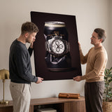 Last Call crushed black stout can with a white dial steel chronograph canvas wall art on a wall with two people beside it
